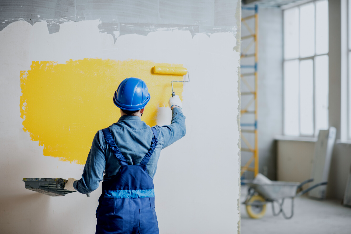 Workamn Painting Wall Indoors